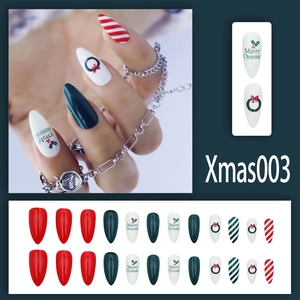 Detailed view of Christmas press-on nails with 24pcs red, green and white festive patterns