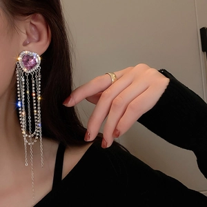 Elegant silver tassel earrings with purple heart crystal and shimmering rhinestones