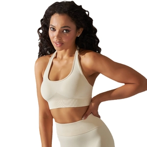 Cream white seamless ribbed knit sports bra and yoga leggings set with halter neck