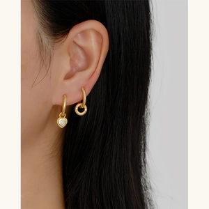 925 silver heart pendant earrings and gold twisted hoop set shown on a model