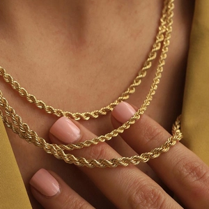Fashionable golden stainless steel twisted rope chain necklace for women in minimalist style