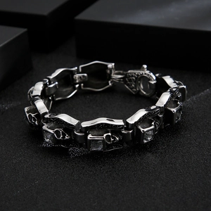 Macro view of gothic skull bracelet featuring square clear zircon and vintage steel finish