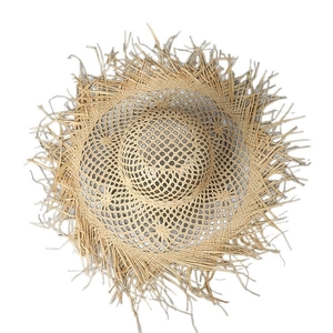 Hollow weave raffia sun hat with wide brim and frayed edges for beach vacations