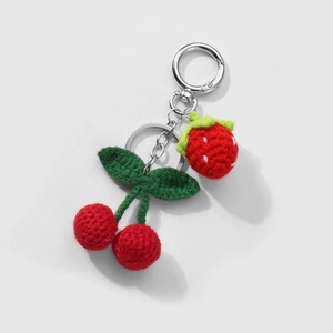 Handmade crochet keychain with cute red cherry and strawberry fruit charms in wool