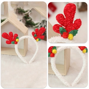 Christmas reindeer antler headband with sequins and holly leaves in a cozy winter setting