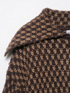 Detail of knit lapel and textured brown geometric pattern on women cardigan
