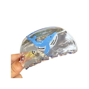 Clear acetate hair claw clip featuring blue whale and goldfish motifs for women