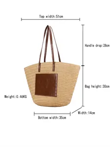 Large woven straw tote bag with brown leather straps and patch for summer beach vacation