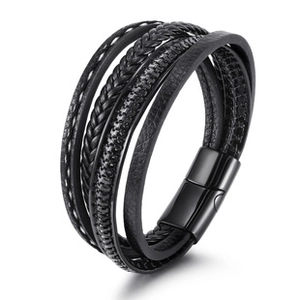 Detail of multi-layer black leather woven bracelet with a magnetic metal clasp closure