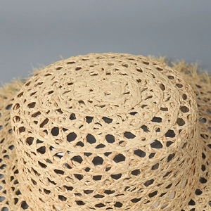 Flat top raffia straw hat with hollow weave and frayed edges for summer sun protection