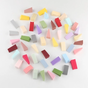 Macro shot of colorful non-latex wedge makeup sponges in various vibrant pastel shades