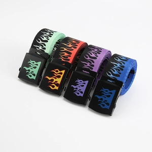 Flat lay of canvas belts in mint green, orange, purple, and blue with flame prints