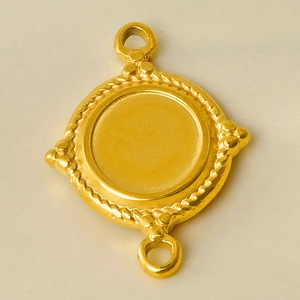 Detailed macro view of a gold 304 stainless steel round pendant with rope edge and dual holes