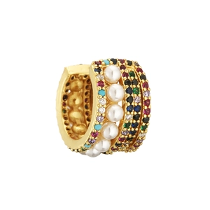 Exquisite gold ear cuff with white pearls and multicolored zircons on white background