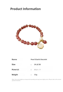 Detail view of pink strawberry quartz bracelet with pearl and golden shell charm