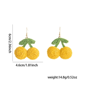 Detailed view of handmade woven cherry earrings with dimensions 6cm by 4.6cm on white background