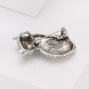 Detailed back view of vintage silver cat brooch showing pin fastening and metal texture