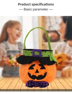 Macro detail of plush Halloween pumpkin candy bag with embroidery and purple bow decoration
