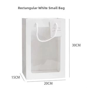 Detailed view of white paper gift bag with large clear window and cotton rope handles