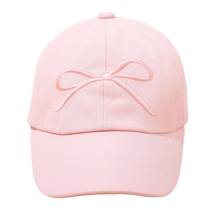 Front view of light pink kids empty top sun hat with bow embroidery and cotton texture