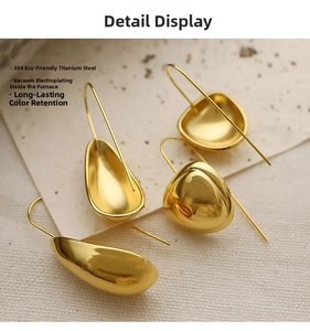 Macro shot of 18K gold plated 304 stainless steel teardrop earrings with smooth finish