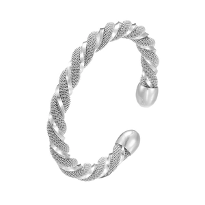 Detail view of silver twisted mesh open bangle with polished metal and sphere ends