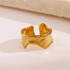 Irregular textured gold stainless steel chunky open ring with a liquid metal design