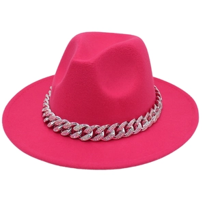 Close-up of bright pink fedora hat with a silver chain and colorful rhinestones
