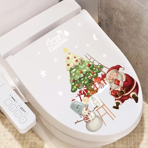 Christmas toilet lid decal featuring Santa, snowman and tree on white bathroom seat