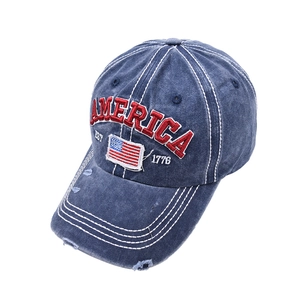 Close-up of retro navy blue washed denim baseball cap with America flag embroidery