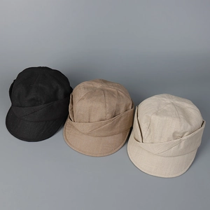 Detailed fabric texture of breathable cotton linen caps in black, khaki, and beige