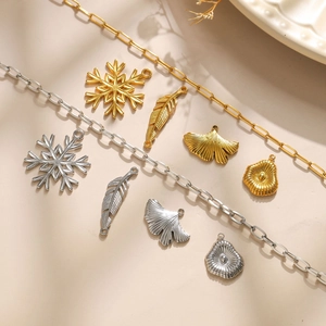 Polished stainless steel pendants in snowflake, leaf, and shell designs for DIY jewelry