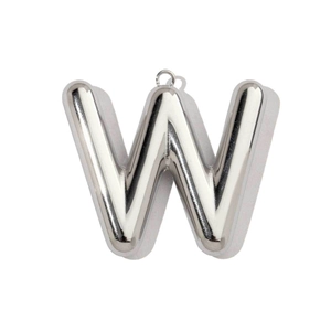 Macro detail of silver hollow 3D metal letter W pendant with mirror polished finish
