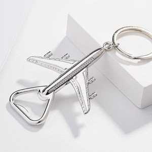 Silver airplane keychain bottle opener in metal with a creative minimalist design