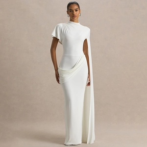 Detail of elegant white one-shoulder maxi dress featuring asymmetrical draped pleats