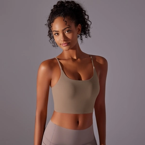 Detail of cross-back yoga crop top with thin straps and seamless high-elastic fabric