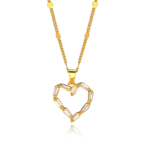 Elegant gold heart pendant necklace with clear zircon stones on a white background