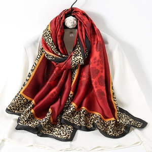 Elegant mulberry silk scarf with burgundy floral patterns and leopard print borders