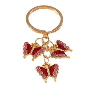 Cute golden key chain featuring three red glitter oil-drip butterflies on white background