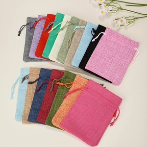 Linen drawstring jewelry pouches in multiple vibrant colors for gift packaging