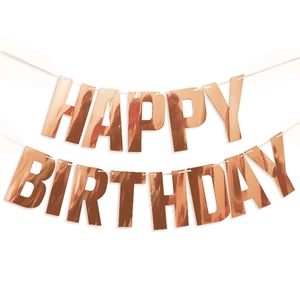 Close-up of rose gold glittery Happy Birthday banner letters with metallic finish