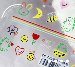 Macro view of cute cartoon dinosaur nail stickers with colorful hand-drawn animal patterns