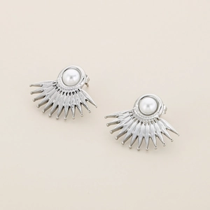 Macro detail of silver fan-shaped earrings with white round pearl insets