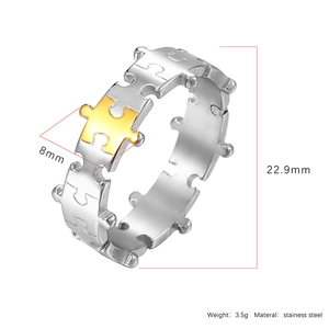Macro detail of 8mm stainless steel puzzle ring showing dimensions and gold-silver finish