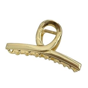 Minimalist large golden metal shark hair clip with a sleek twisted ring design