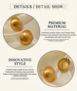 Detail of 18k gold plated brushed stainless steel oval earrings with matte finish