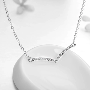 Minimalist S925 sterling silver V-shape necklace with paved zircons on white ceramic