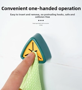 Detail of adhesive wall-mounted towel plug showing single-handed push operation