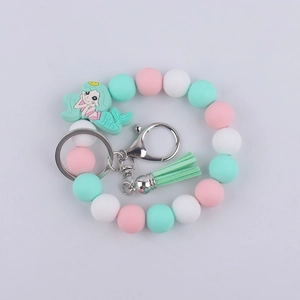 Silicone mermaid keychain bracelet with pastel beads and pink tassel detail