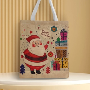 Detail of Santa Claus and Christmas tree print on a beige canvas tote bag surface